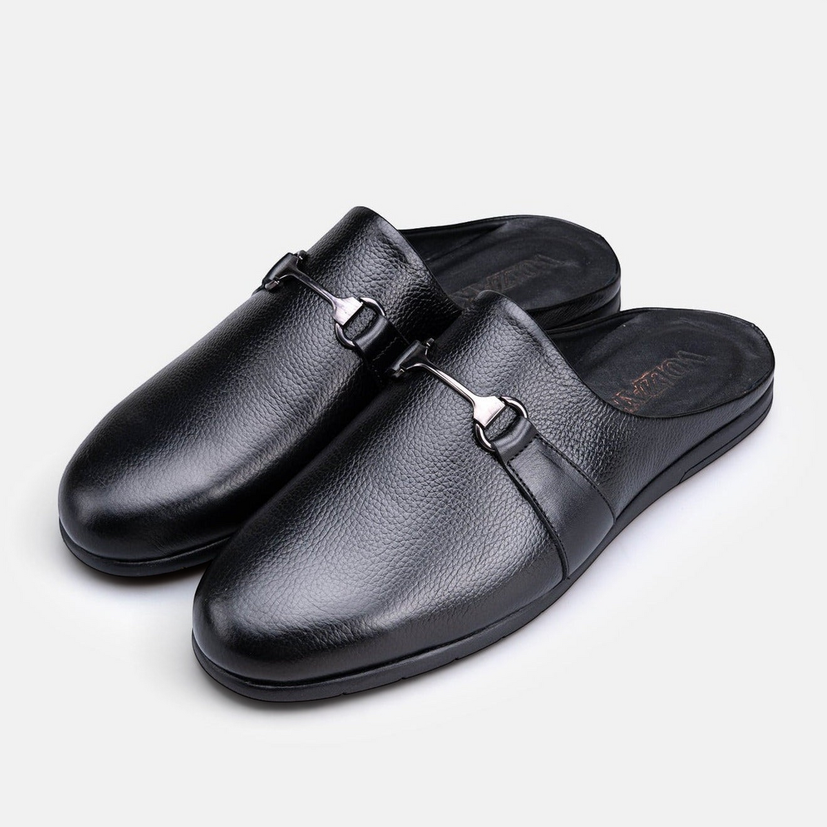 VOLZAK black grained leather mule slippers with a silver-tone metal horsebit detail and rubber sole.