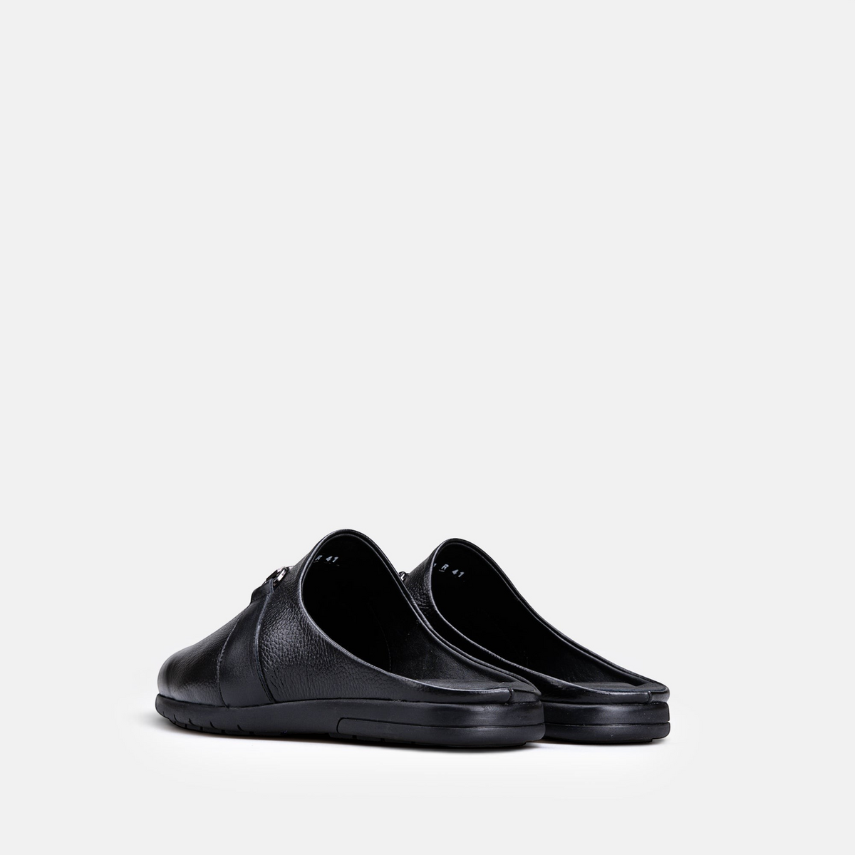 VOLZAK 5600 black grained leather mules with a comfortable rubber sole, shown from a rear angle.