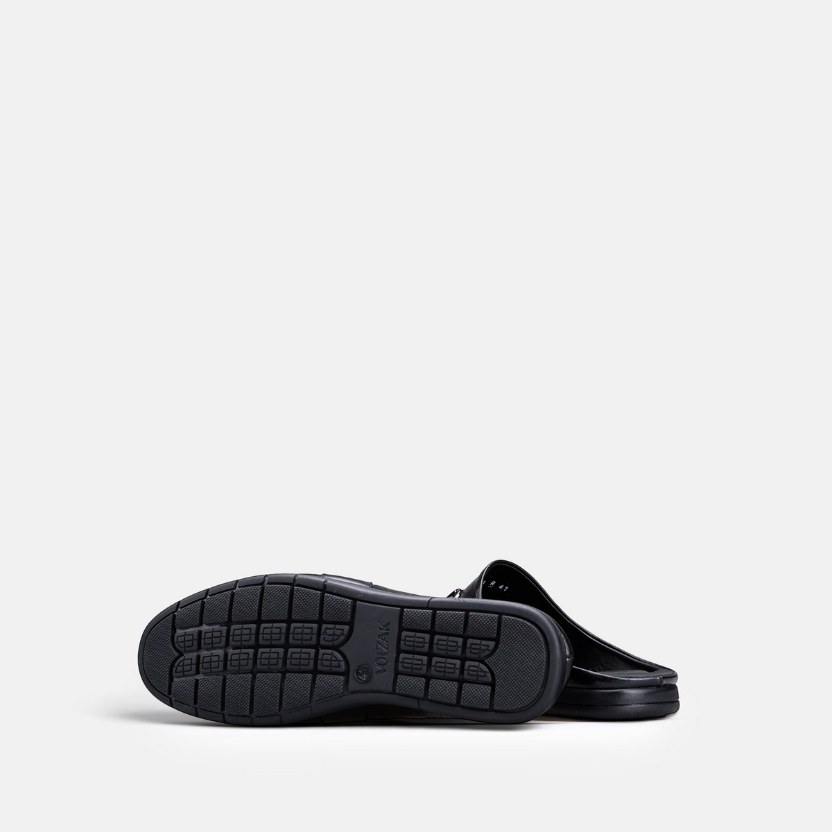 VOLZAK 5600 black grained leather mule showing the textured rubber sole with grip pattern