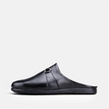 VOLZAK 5600 black grained leather mule with a side buckle detail and a durable rubber sole, side profile view.