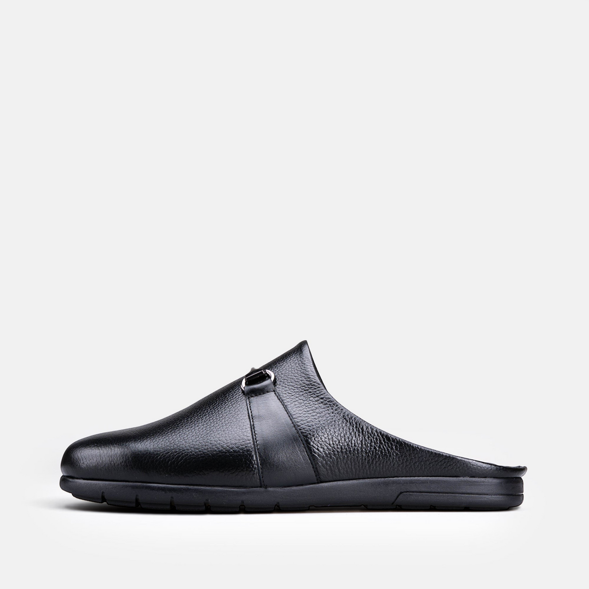 VOLZAK 5600 black grained leather mule with a side buckle detail and a durable rubber sole, side profile view.