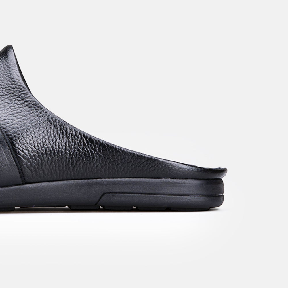 VOLZAK 5600 mule in black grained leather with a durable rubber sole, side profile view.