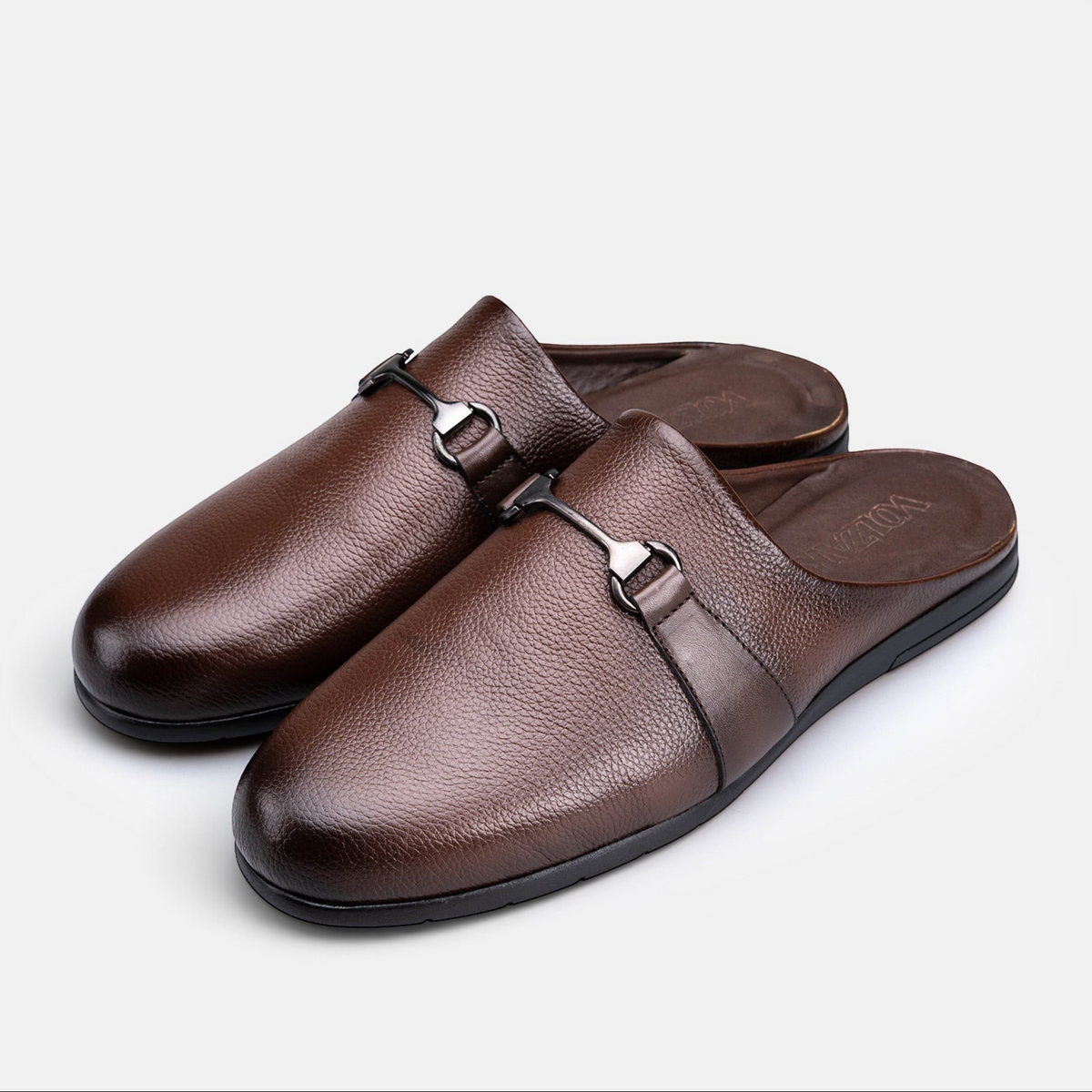VOLZAK 5600 brown grained leather mules with a metal bit detail and rubber sole