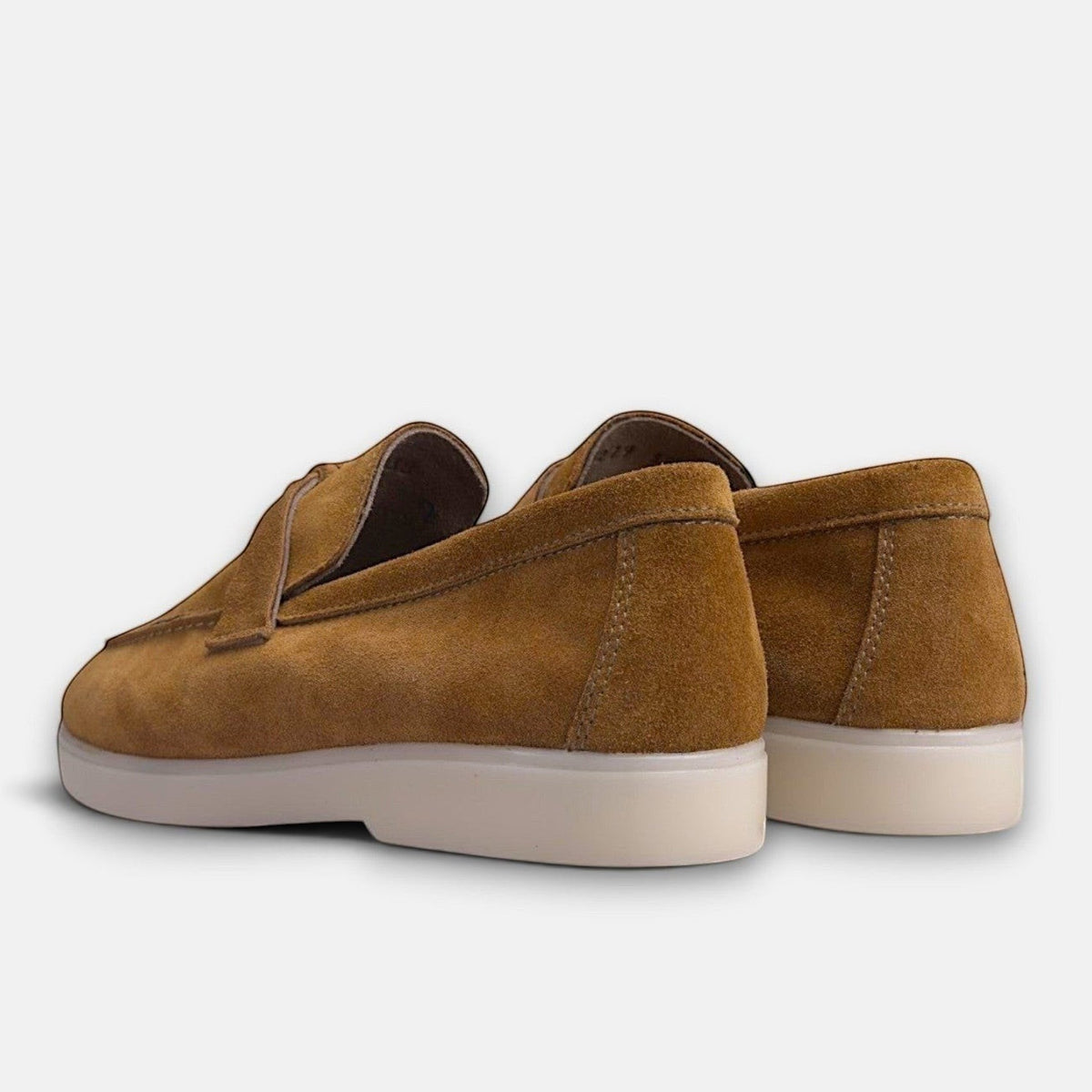 VOLZAK 279 camel suede loafers with a white rubber sole, shown from a rear angle.