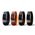 Four VOLZAK leather belts in blue, tan, brown, and black with automatic buckles and precise ratchet adjustment systems.